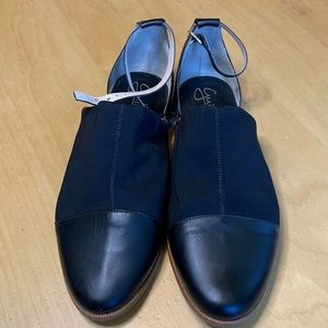 Guillermina ankle strap flat shoe.